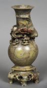 A Chinese carved soapstone vase Decorated with a dragon and phoenix chasing a flaming pearl.