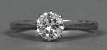 A platinum and diamond solitaire ring With pierced shoulders,