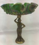 A Continental Art Nouveau iridescent glass and spelter figural tazza The shaped moulded bowl