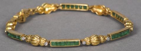 An 18 ct gold, emerald and diamond set bracelet 18.5 cm long overall.