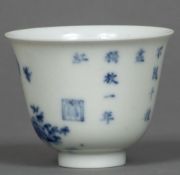 A Chinese blue and white eggshell porcelain wine cup Decorated with insects amongst floral sprays