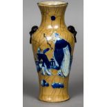 A 19th century Chinese porcelain vase With twin ring and mask handles decorated with a scholar and