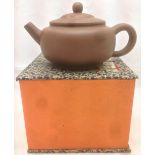 A Chinese Yixing pottery teapot and cover Of typical form,