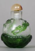 A Peking glass overlay snuff bottle Decorated with a frog and a dragonfly amongst lily pads. 6.