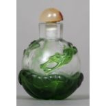 A Peking glass overlay snuff bottle Decorated with a frog and a dragonfly amongst lily pads. 6.