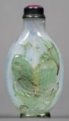 A Chinese Peking green overlay glass snuff bottle Decorated with a fish and water plants,