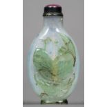 A Chinese Peking green overlay glass snuff bottle Decorated with a fish and water plants,