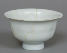 A Chinese porcelain celadon glazed bowl Formed as a lotus. 7 cm high.