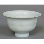 A Chinese porcelain celadon glazed bowl Formed as a lotus. 7 cm high.