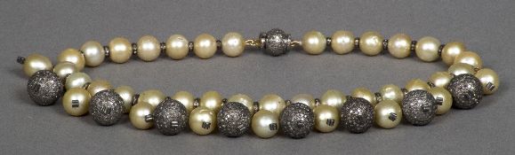 A large pearl and diamond set drop necklace 39 cm long.