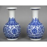 A pair of Chinese blue and white porcelain baluster vases Each decorated with lotus strapwork.