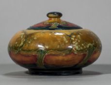 A Moorcroft Eventide pattern pot and cover Of squat form,