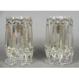 A pair of Victorian cut glass candle lustres Of typical form, each with ten pendant prisms. 22.