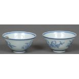 A pair of Chinese blue and white porcelain tea bowls Each decorated with fruiting sprays and