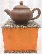 A Yixing pottery teapot Of typical form, with faux bamboo handle and spout,