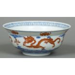 A Chinese porcelain bowl With flared rim, the interior decorated with a five clawed dragon,