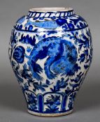 A 19th century Qajar pottery vase Of large ovoid form, decorated with fish,