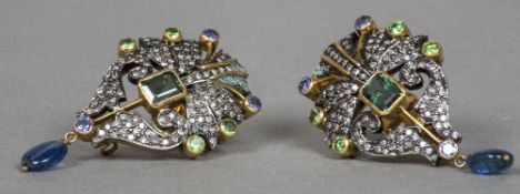 A pair of unmarked gold and silver ear pendants Each of pierced scrolling form, set with diamonds,