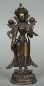 An Indo-Persian gilt bronze figure of a deity Typically modelled. 32 cm high.