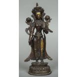 An Indo-Persian gilt bronze figure of a deity Typically modelled. 32 cm high.