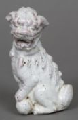 A Chinese porcelain model of a temple lion Modelled seated with allover white crackle glaze.