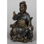 A Chinese gilt and polychrome decorated cast bronze figure of an emperor Modelled seated on a