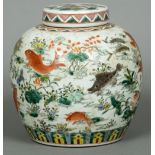 A Chinese porcelain ginger jar Decorated in the round with fish in a pond. 24 cm high.