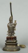 A Chinese carved agate model of Guanyin Modelled holding a vase,