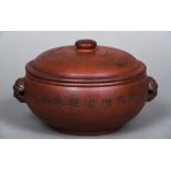 A Chinese Yixing food bowl and cover With removable domed lid, twin mask handles,