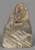 A Chinese carved agate seal The top carved with a figure, possibly Shoa Loa,