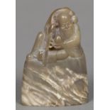 A Chinese carved agate seal The top carved with a figure, possibly Shoa Loa,