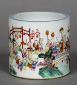 A 19th century Chinse porcelain brush pot Extensively painted with celebratory figures in a