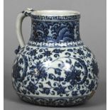 A Chinese Ming blue and white porcelain jug The body decorated with lotus strapwork,