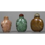 Three Chinese carved hardstone snuff bottles and stoppers Of typical form. The larger 7.5 cm high.