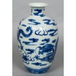 A Chinese blue and white porcelain dragon vase Decorated with five-clawed dragons chasing a flaming