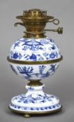 A Meissen blue and white gilt metal mounted porcelain oil lamp (in two sections) Decorated with the