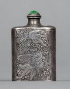 A Chinese silver snuff bottle Decorated with fish and lilies, with a jade cabochon mounted stopper,