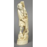 A late 19th/early 20th century Japanese carved ivory okimono Worked as a jovial fisherman.