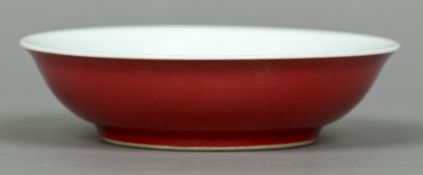 A Chinese porcelain dish The exterior with a red glaze,