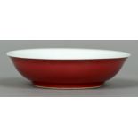 A Chinese porcelain dish The exterior with a red glaze,