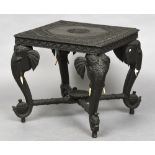 A late 19th century Ceylonese carved hardwood side table The florally carved square section top