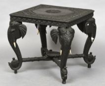 A late 19th century Ceylonese carved hardwood side table The florally carved square section top