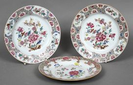 Three 18th century Chinese famille rose plates Each typically decorated with floral sprays.