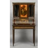 A 19th century French marble topped brass mounted bonheur de jour The brass three quarter galleried