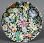 A Chinese porcelain plate Decorated in the Millefleur pattern,