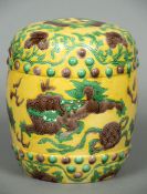 A small Chinese yellow ground barrel form seat Decorated in the round with trailing foliage and