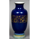 A Chinese porcelain powder blue vase, possibly 19th century Decorated with an archaistic gilt band,