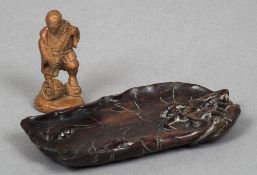 A Chinese carved hardwood brush washer Formed as a lily pad;