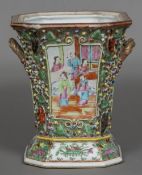 A Chinese Canton porcelain twin handled flower vase Typically decorated with figural vignettes on a