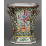 A Chinese Canton porcelain twin handled flower vase Typically decorated with figural vignettes on a